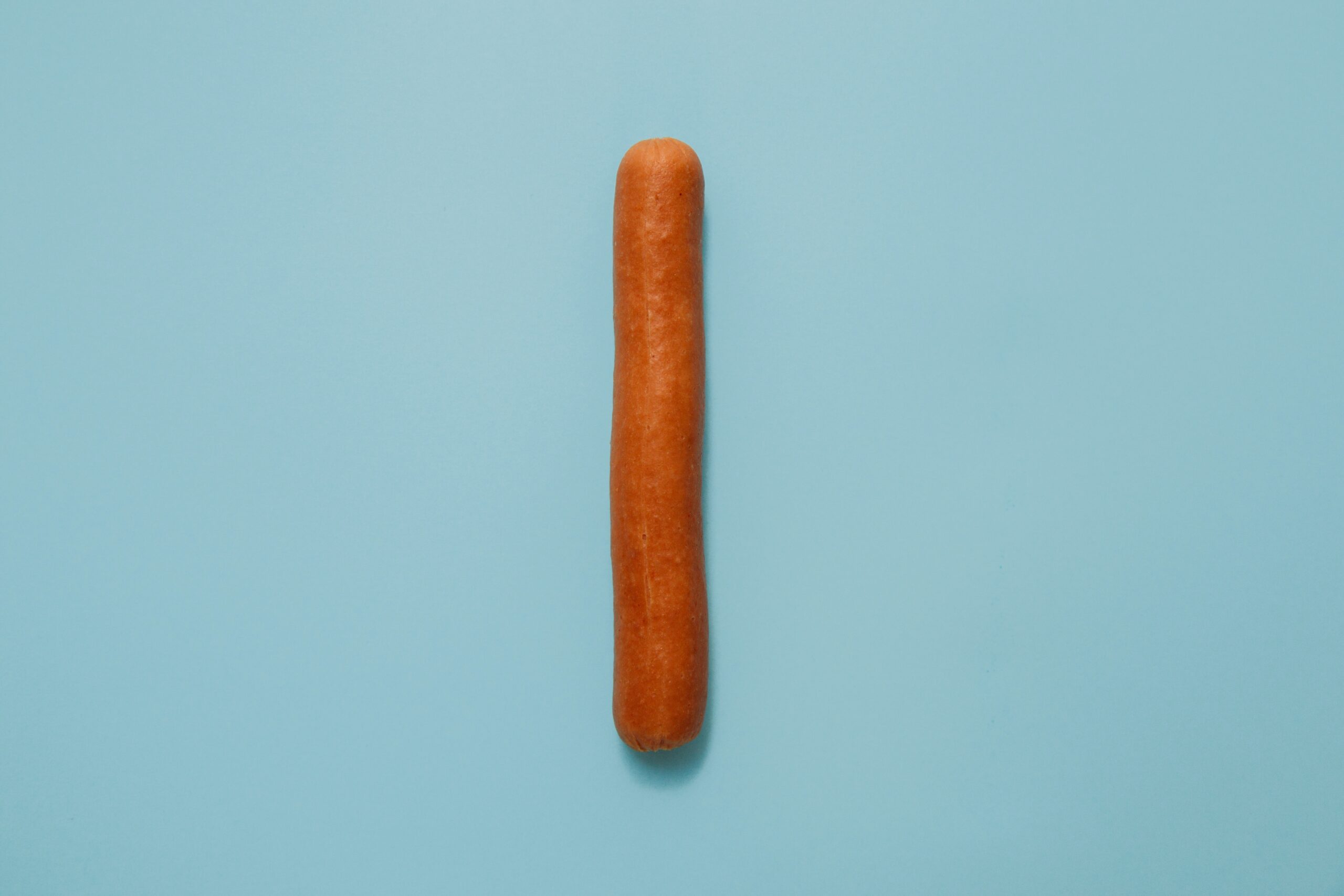 A sausage on a blue background