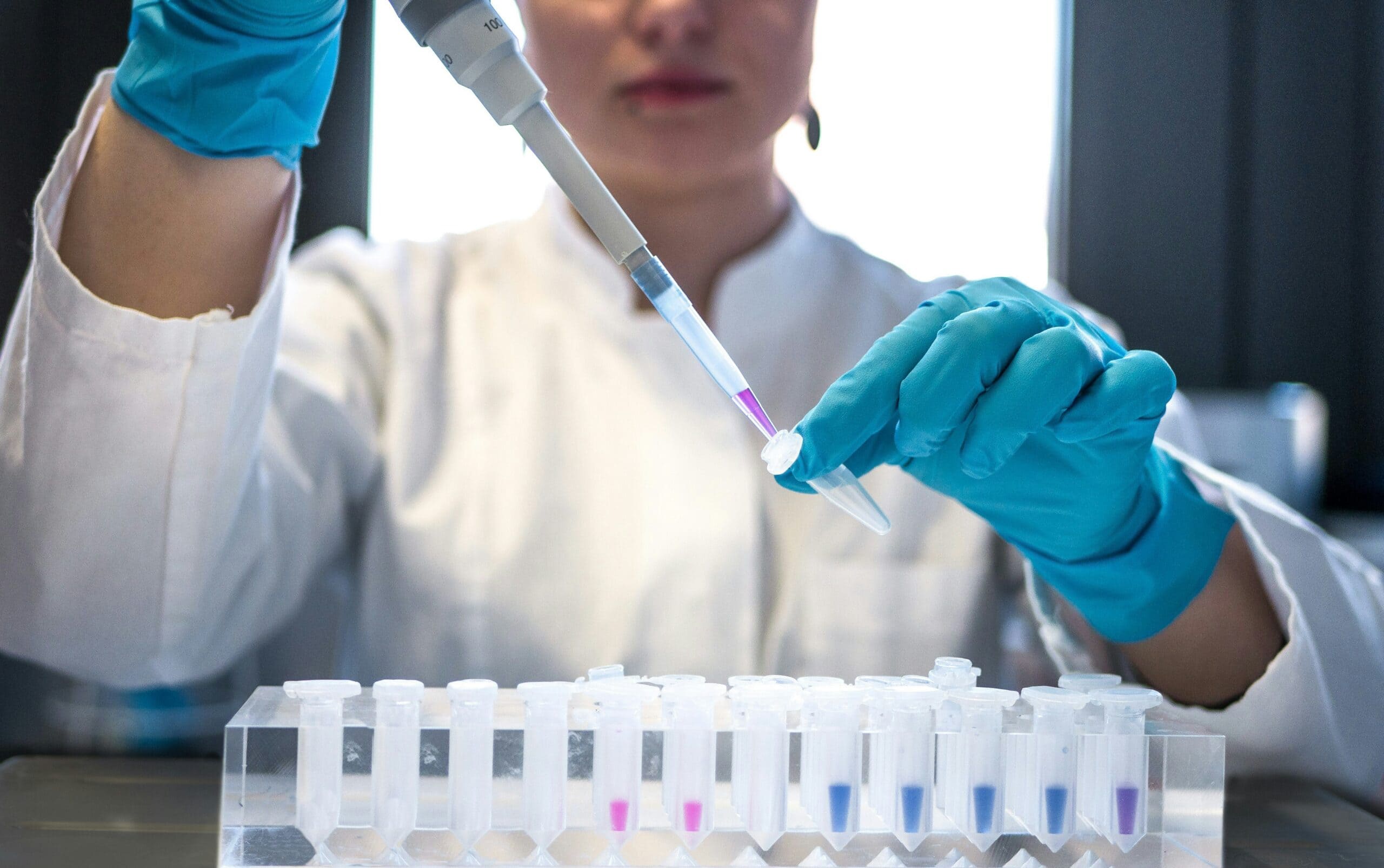 Lab worker filling medical supplies